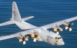 Lockheed C-130 Hercules flying over water